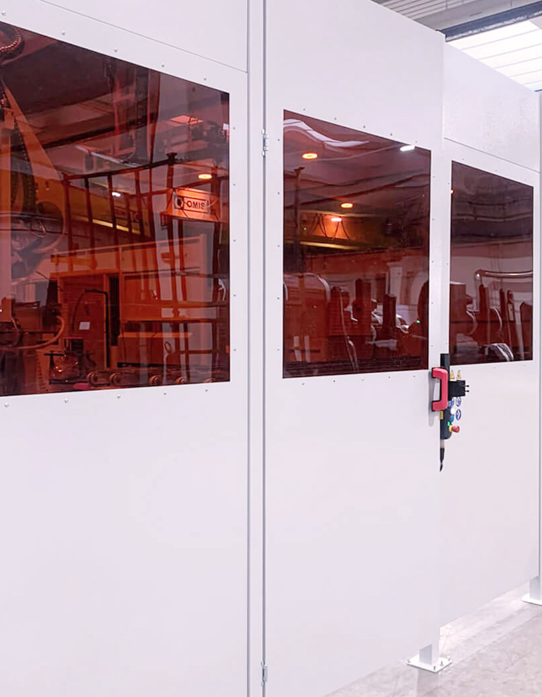 Satech perimeter protection in white sheet metal with red porthole for welding areas